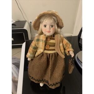 vintage porcelain doll with a brown dress